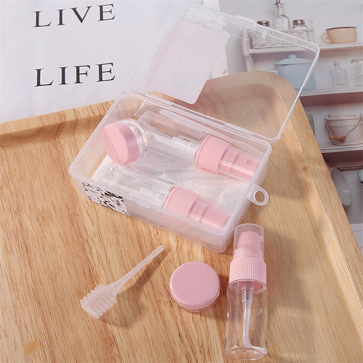 Hot Sale Eco-friendly Make Up Cosmetic Travel Bottle Kit 9pcs Lotion Spray Bottle Plastic Travel Set With Pink Lid MDL551